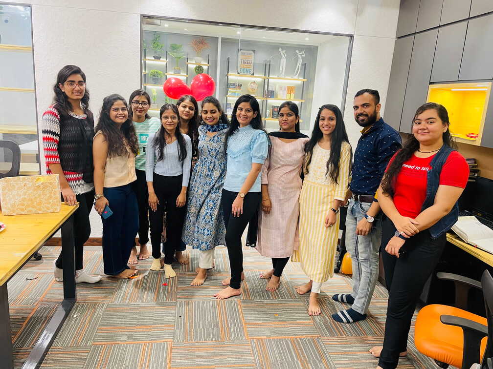 Team members posing together in the office